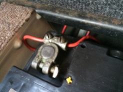 Bolted in place and inline fuse poked under passenger seat
