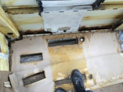The section between floor and side panel has completely rotted away