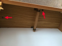 Two screws secure the wardrobe into the roof
